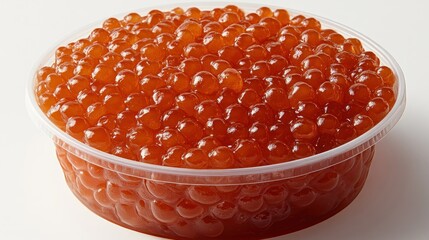Round container of red caviar