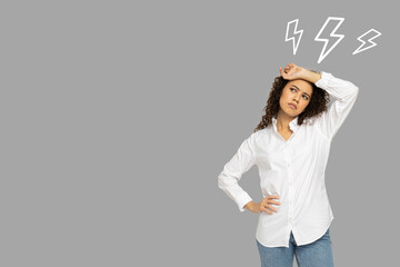 Stress month, tired woman in a white shirt on a grey background, space for text