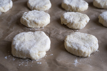 Cookies before baking on bakery paper.