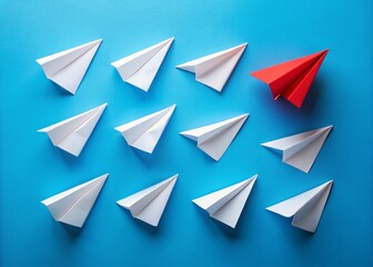 Fototapeta premium Red Paper Airplane Leading White Fleet: Teamwork, Growth, Business Leadership Stock Photo