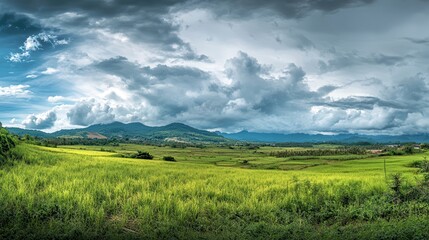 Obraz premium Stormy sky over lush green valley