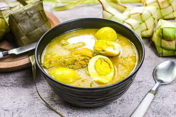 Traditional Indonesian food on Eid al-Fitr, ketupat and chicken and egg curry