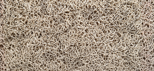 vinyl floor mat, close up view of a textured beige surface with intricate loops and strands, densely packed pattern, texture analysis, material science, and design patterns high detail textures