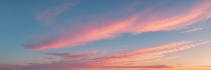 Fototapeta premium Dreamy pastel skies, serene cloudscape featuring gentle pink and blue hues at twilight hour