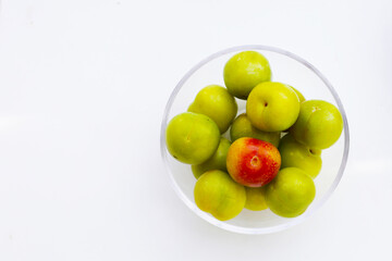 Fresh green plum on white background