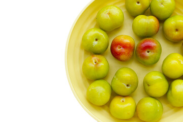 Fresh green plum on white background
