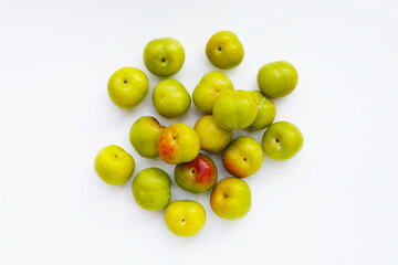 Fresh green plum on white background