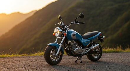 Teal Motorcycle Parked on Mountain Road at Golden Hour Light