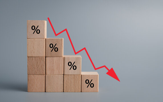 Business turnover decreased, interest rate decline, Stacked wooden block form staircase with percentage sign and down arrow on color background, recession crisis concept.