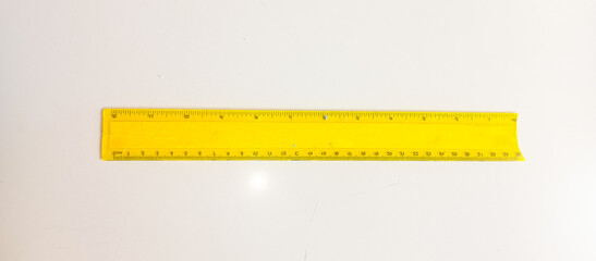 yellow ruler on a white background