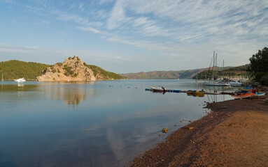 Fototapeta premium View of Kizkumu Bay in Orhaniye Village in the morning. Maiden's sand is a popular tourist attraction in Mugla. Marmaris town, Turkey country 