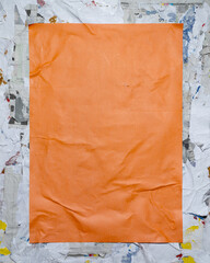 Orange vertical paper poster on dirty street style wall. collage art paper frame mockup.