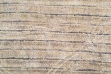 Aerial texture of Finnish agricultural field with distinct plough lines and soil patterns. Drone capture reveals subtle beige and grey contours created by modern farming techniques in Nordic farmland