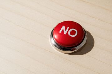 Red push button with the word no