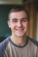Fototapeta premium Portrait of smiling young man wearing t-shirt
