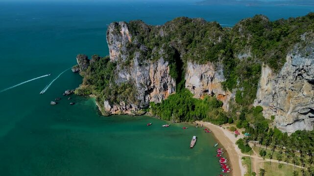Experience breathtaking views of Tonsai beach Krabi Thailands coastline featuring dramatic cliffs, pristine beaches, and vibrant turquoise waters. 