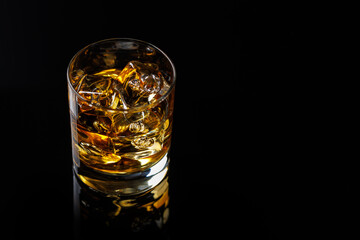 A refined glass of whiskey on the rocks