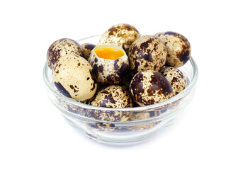 Glass bowl with quail eggs isolated on white