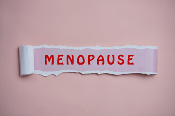 Word MENOPAUSE on pink background.