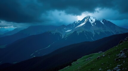 The Apennines (Gran Sasso d&rsquo;Italia, Majella) during rainy night conditions, photographed from a panoramic perspective, capturing misty mountains under dark skies.