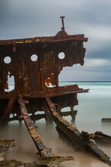 Fototapeta premium Rusty hull plates of a shipwreck steam ship SS Maheno on the eastern beach of Kgari - Fraser Island Australia