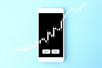 スマホで投資をするイメージ画像