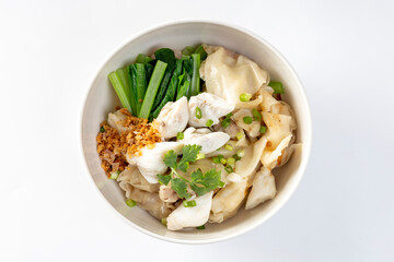 chinese egg noodle in bowl with slice red roasted pork, pork's wontons and white crab meat on it.