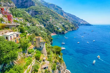 Positano town, beach and beautiful colorful houses on the cliff in Amalfi coast in Italy