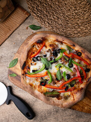 Homemade Sourdough pizza on Wooden Table.