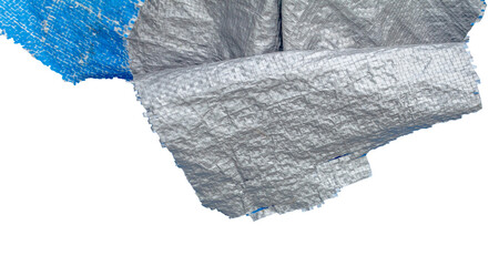 Weathered Torn Blue Tarpaulin with Silver Layer Peeling Off. Aged and Fragile Plastic Sheet. Element For Creative Project.
