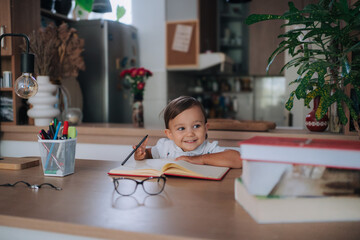 Focused Little Artist Young Child Doodling in a Notebook with Enthusiasm