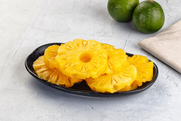 Sweet canned pineapple slices in syrope