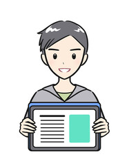 タブレットを手に持つ小学生の男の子