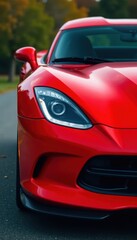 Fototapeta premium Aggressive red sports car, front fascia detail, shiny, bumper