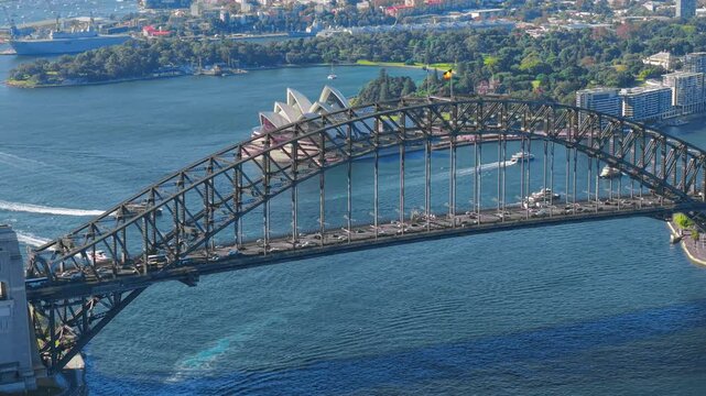 Close up drone video of the Sydney Harbour Bridge and the Opera House as the drone flies east revealing more of north Sydney