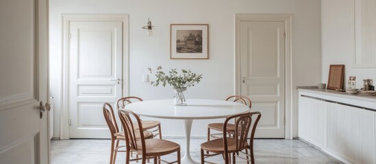 Serene dining room with tulip table and vintage-inspired decor elements