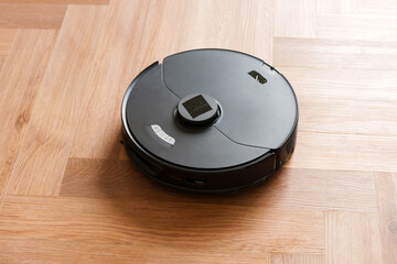 Robot vacuum cleaner performs automatic cleaning of the apartment at a certain time. Smart home....