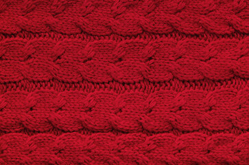 The texture of a knitted woolen fabric red.