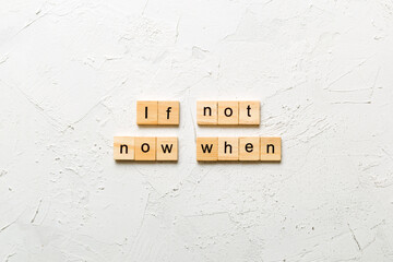 If not now when word written on wood block. If not now when text on cement table for your desing,...