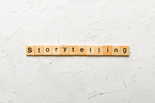 storytelling word written on wood block. storytelling text on table, concept