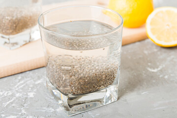 Healthy breakfast or morning with chia seeds and lemon on table background, vegetarian food, diet...