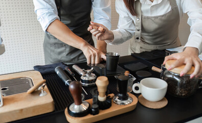 Coffee Preparation and Artisan Skills. Baristas collaboratively showcasing their skills in brewing and serving coffee.