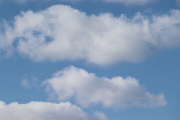 Background with white clouds and blue sky