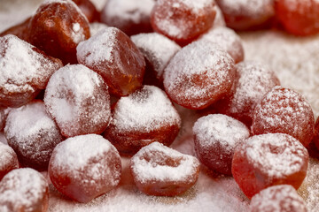 candied fruits of kumquat boiled in sugar syrup in powdered sugar