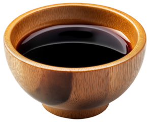 Soy sauce in small wooden bowl isolated on transparent background.