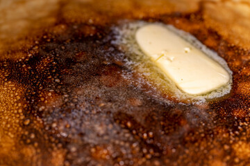 butter melts on fresh hot pancakes