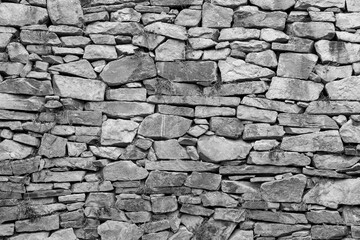 Texture of an old stone wall in black and white
