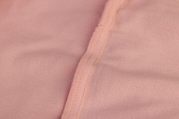 Fototapeta premium details of a part of the pink fabric that is used to make clothes