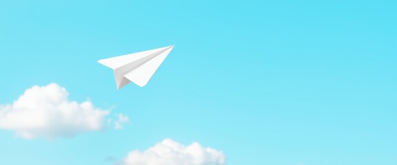 Minimalist paper airplane soaring in clear blue sky with cloud formations and copy space