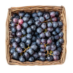 Fototapeta premium Freshly Harvested Purple Grapes in Woven Basket Top View Isolated